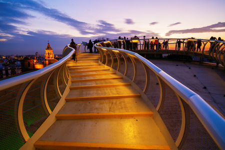 Seville, Spain - November 13, 2018: Metropolitan Parasol with unidentified people at night. It is a wooden structure designed by Juergen Mayer, with dimensions 150 by 70 meters and 26 meters highのeditorial素材