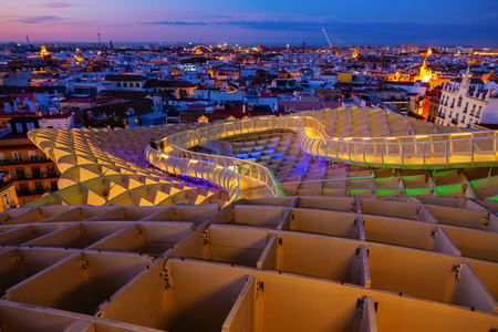 Seville, Spain - November 13, 2018: Metropolitan Parasol with unidentified people at night. It is a wooden structure designed by Juergen Mayer, with dimensions 150 by 70 meters and 26 meters highのeditorial素材