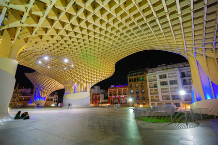 Seville, Spain - November 13, 2018: Metropolitan Parasol with unidentified people at night. It is a wooden structure designed by Juergen Mayer, with dimensions 150 by 70 meters and 26 meters highのeditorial素材