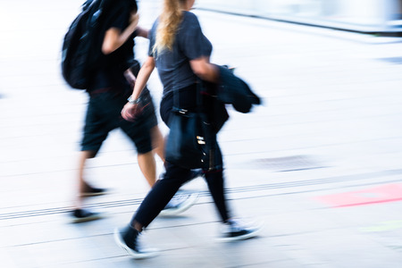 People walking in the city in motion blur