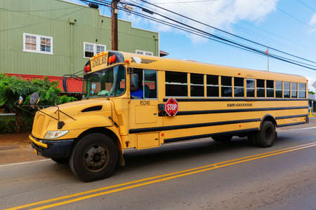 Haleiwa, Hawaii, US - November 07, 2019: American yellow school bus with unidentified person. The yellow color was especially formulated for use on school buses in North America in 1939のeditorial素材