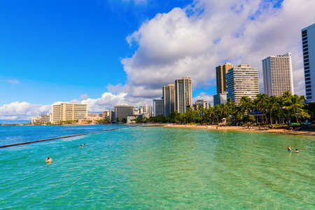 Honolulu, Oahu, Hawaii - November 04, 2019: view of Waikiki beach with unidentified people. Waikiki is a neighbourhood of Honolulu, most famous for Waikiki beach, which is almost entirely man-madeのeditorial素材