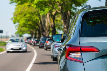 picture of cars on the street with busy traffic