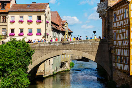 Bamberg, Germany - June 15, 2019: bridge over the river Regnitz in the old town of Bamberg, Bavaria, with unidentified people. Bamberg is a city in Bavaria and well known for its medieval old townのeditorial素材