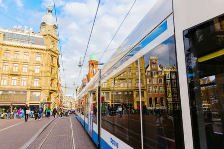 Amsterdam, Netherlands - October 28, 2019: street scene with street car in Amsterdam, with...