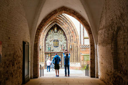 Stralsund, Germany - May 12, 2018: archway through patio of the city hall of Stralsund with...