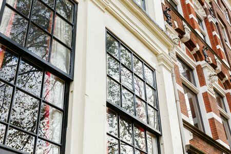 picture of a window front of typical old buildings in Amsterdam, Netherlandsの写真素材
