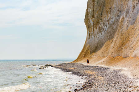 Sassnitz, Germany - May 10, 2018: stony beach with unidentified people at the chalk cliffs of Ruegen. The area is part of the Jasmund National Park and part of the UNESCO world heritageのeditorial素材
