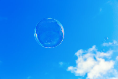 picture of a soap bubble flying in front of the sky