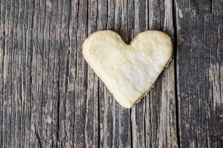 Heart of the cookies and the wooden background.の写真素材
