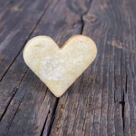Heart of the cookies and the wooden background.の写真素材