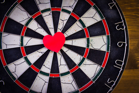 Red heart in the center dartboard.の写真素材