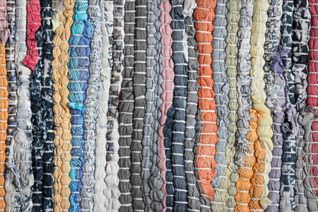 Carpet striped made from little pieces of colorful woven cotton