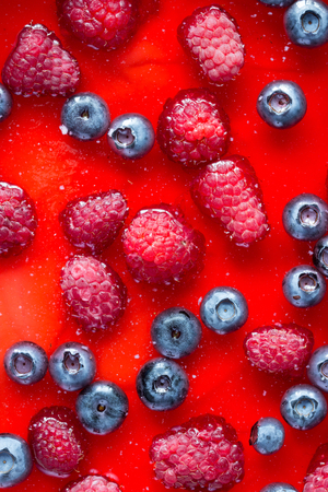 Cheesecake with the fresh raspberries and blueberries