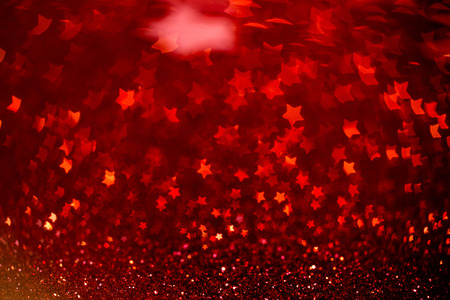 Festive Christmas background with stars. Abstract twinkled bright background with bokeh defocused lightsの写真素材