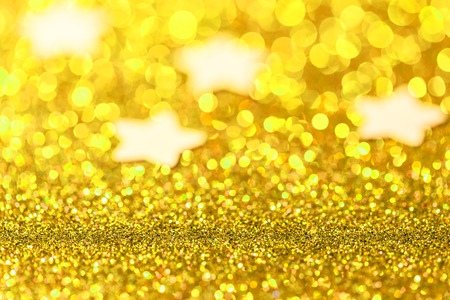 Festive Christmas background with stars. Abstract twinkled bright background with bokeh defocused...