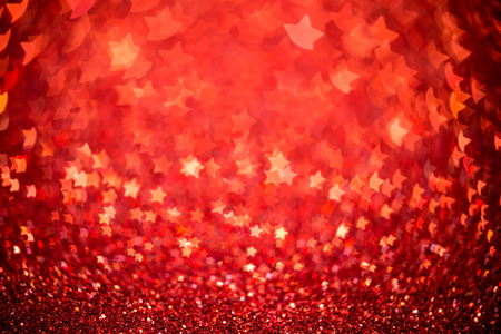 Festive Christmas background with stars. Abstract twinkled bright background with bokeh defocused...