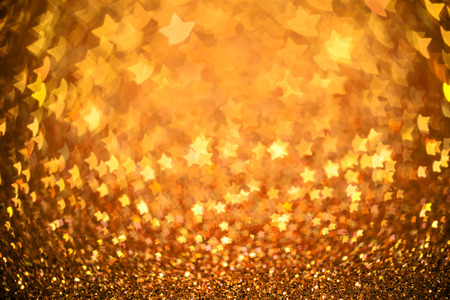 Festive Christmas background with stars. Abstract twinkled bright background with bokeh defocused...