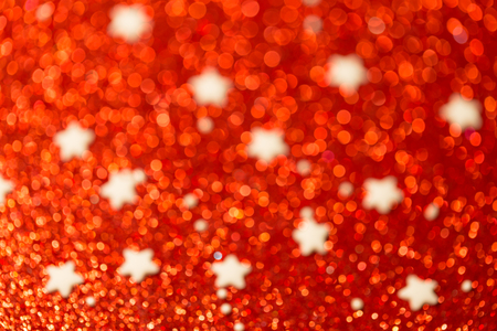 Festive Christmas background with stars. Abstract twinkled bright background with bokeh defocused lightsの写真素材