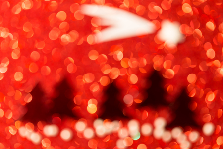Festive background with christmas tree. Abstract twinkled bright background with bokeh defocused lightsの写真素材