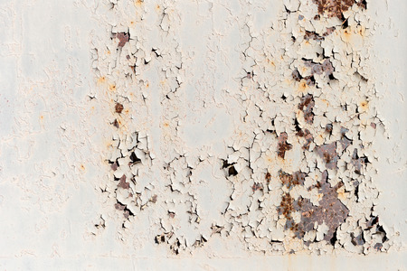 Old painted metal texture with traces of rust and cracks.の写真素材