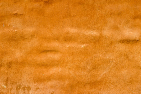 Stucco orange wall background or texture