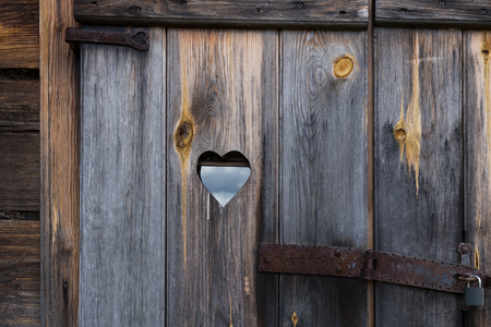 The wooden door with heart. Backgroundの写真素材