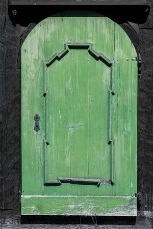 Old green wooden door - grunge background texture for design.の写真素材