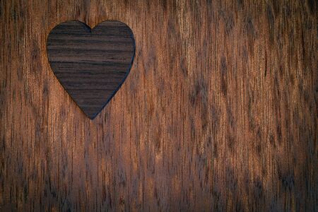 Wooden heart on old wooden background.の写真素材