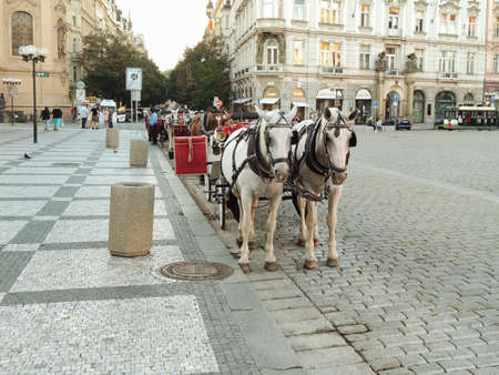 Prague, Czech Republic - September 27, 2020: horse-drawn carriage, Old Town Square markets, restaurants, People crowded at the Old Town Square in Pragueのeditorial素材
