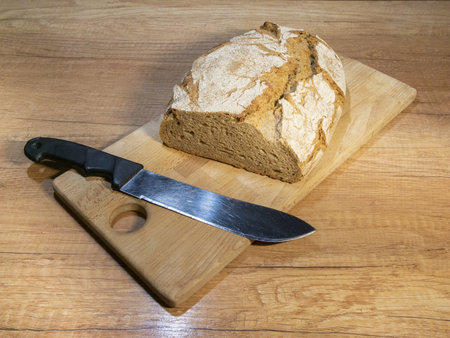 Freshly baked aromatic bread. Bread in a cut. Fragrant pastries close-up. Homemade sourdough bread....
