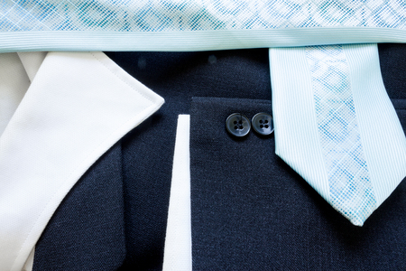 Close up of a few buttons on a business suit coat