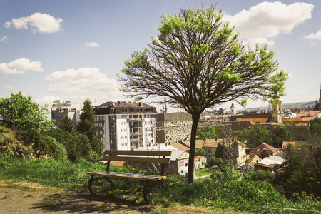 A relaxation bench above the city somewhere in Romaniaの写真素材