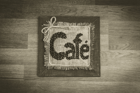 A design made for a cafe. Made from cotton, wood and coffee beansの写真素材