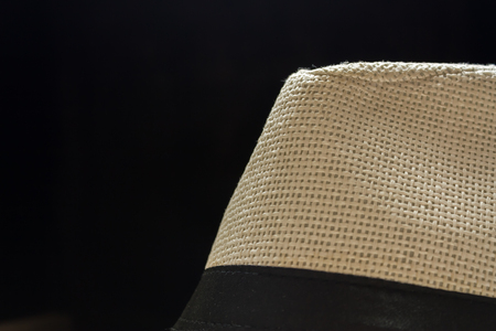 Shot of a top of fedora hat in dark black backgroundの写真素材