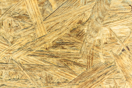 Closeup shot to a yellow compressed wood textureの写真素材