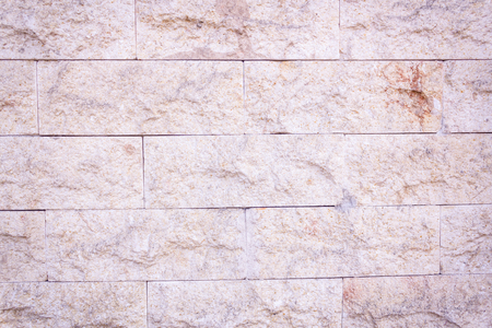Close up shot to a rocky brick wall patternの写真素材