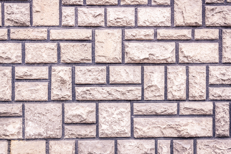 Close up shot to a rocky brick wall patternの写真素材