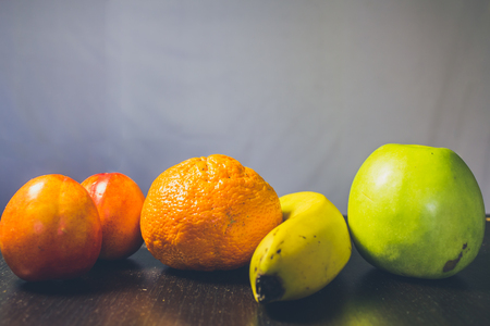 Summer tasty fruits on a dark backgroundの写真素材