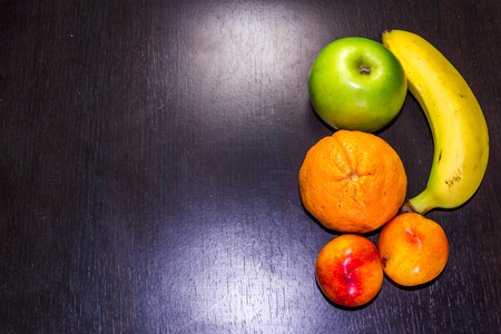 Summer tasty fruits on a dark backgroundの写真素材