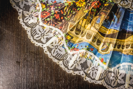 Close up shot to a decorated fan on a wooden backgroundの写真素材