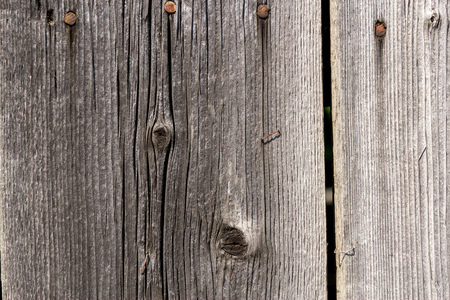 Close up shot to a textured dark wooden fenceの写真素材