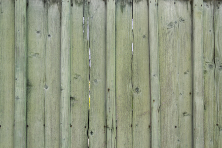 Close up shot to a green wooden fenceの写真素材