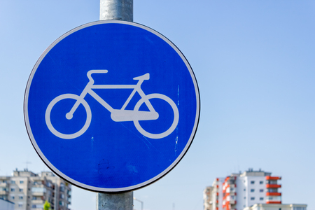 Close up shot to a traffic sign indicating a bicycle route nearbyの写真素材
