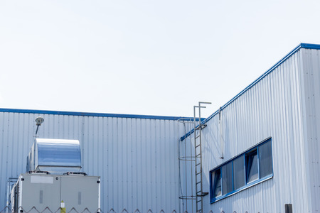 Close up shot to a part of a factory and the stairs to go on top of itの写真素材