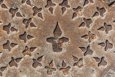 Close up shot to a rusty sewer coverの写真素材