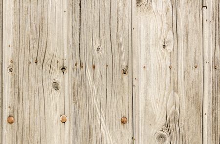 Close up shot to a textured white wooden fenceの写真素材