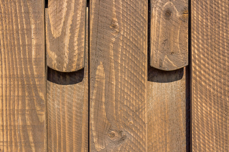 Close up shot to a textured brown wooden fenceの写真素材