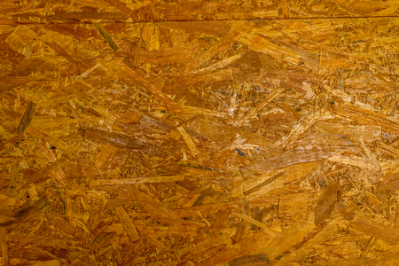 Closeup shot to a yellow compressed wood textureの写真素材