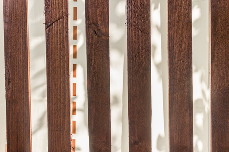Wooden planks with a whte curtain as a backgroundの写真素材